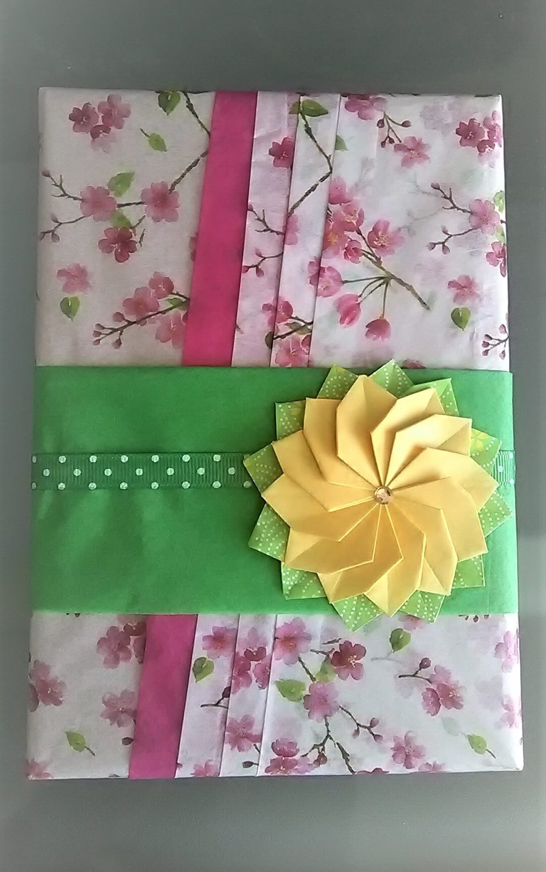 Book gift wrapping with origami flowers